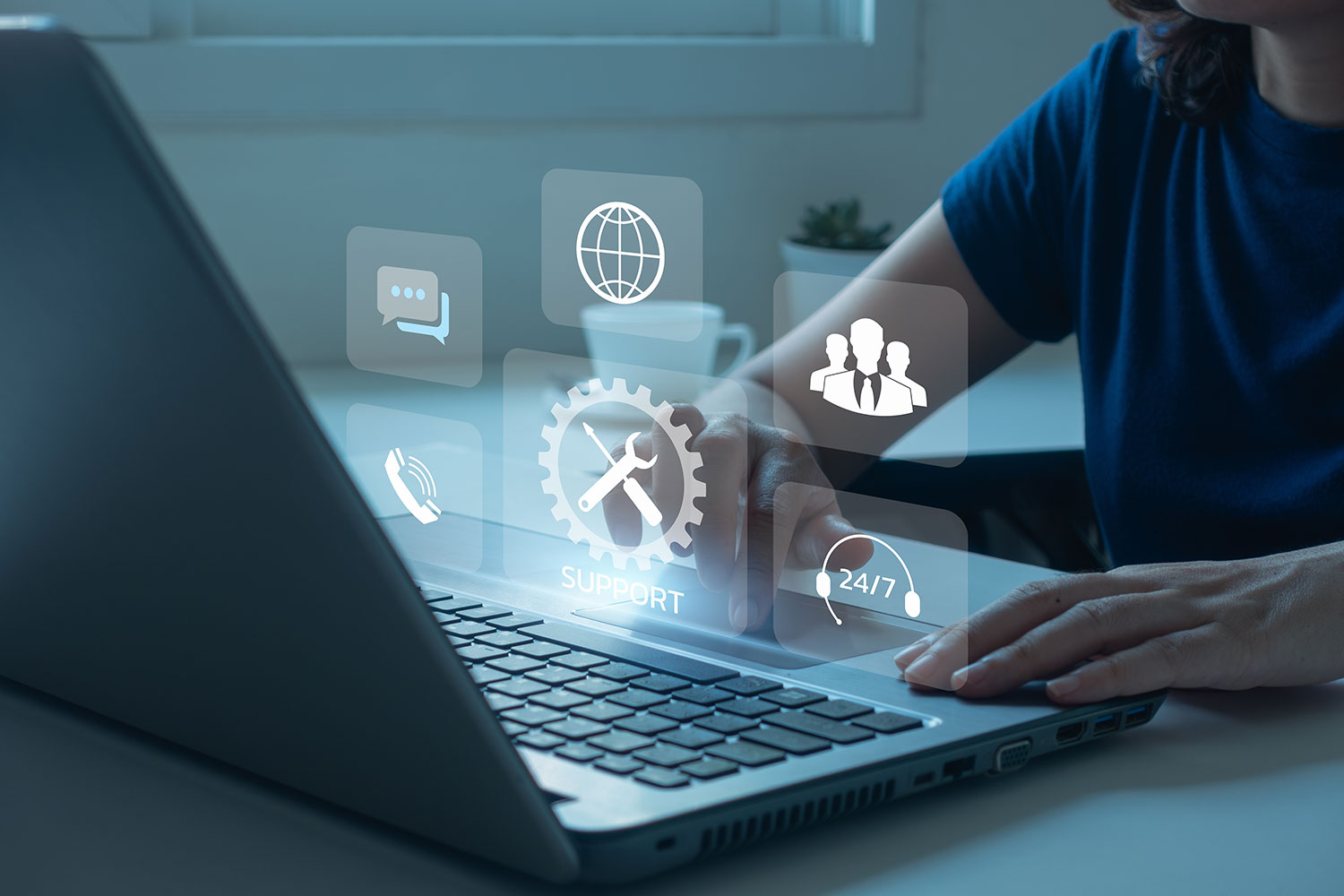 Image showing woman using laptop to reach Learning Management System Support